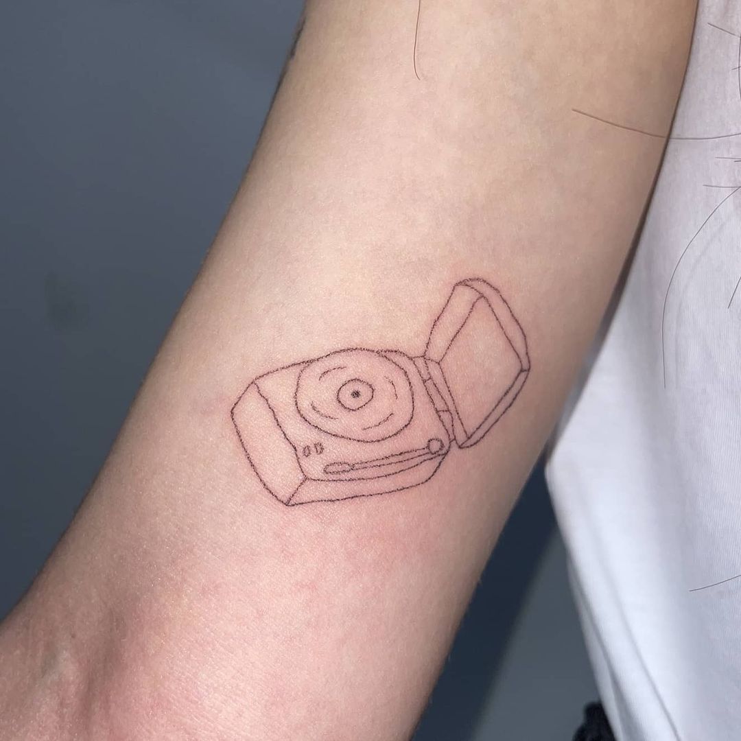 tatuagem de música no braço